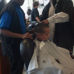 Dunbar Barber Academy - Instructing student