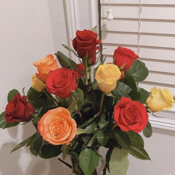 Flowers For All Seasons - A dozen mixed roses arrangement without fillers - Florists Near Me