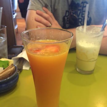 Snooze, an A.M. Eatery - Mmm mom mimosa. Mimosa plus pomegranate liqueur - Breakfast & Brunch Near Me - Centennial, Colorado
