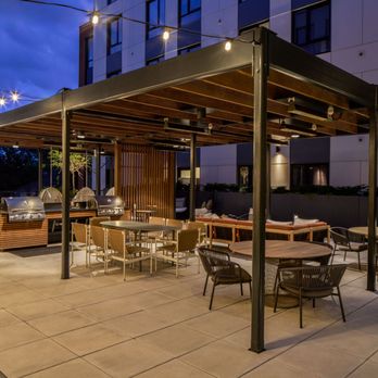 Porter - The outdoor terrace brightly lit in the evening - Apartments Near Me - Oak Park, Illinois Porter - The outdoor terrace brightly lit in the evening - Apartments Near Me - Oak Park, Illinois