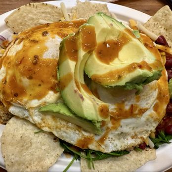 fresh&co - Huevos Rancheros, over easy eggs atop fresh kale, quinoa, full avocado (what!), tortillas, onion, beans, hot sauce. Ya kiddin' me! - Salad Near Me - New York, New York fresh&co - Huevos Rancheros, over easy eggs atop fresh kale, quinoa, full avocado (what!), tortillas, onion, beans, hot sauce. Ya kiddin' me! - Salad Near Me - New York, New York