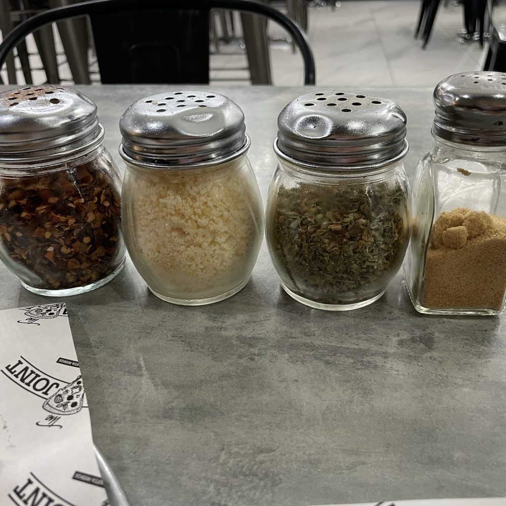 Condiments (chili flakes, parmesan cheese, oregano, garlic powder) Condiments (chili flakes, parmesan cheese, oregano, garlic powder)