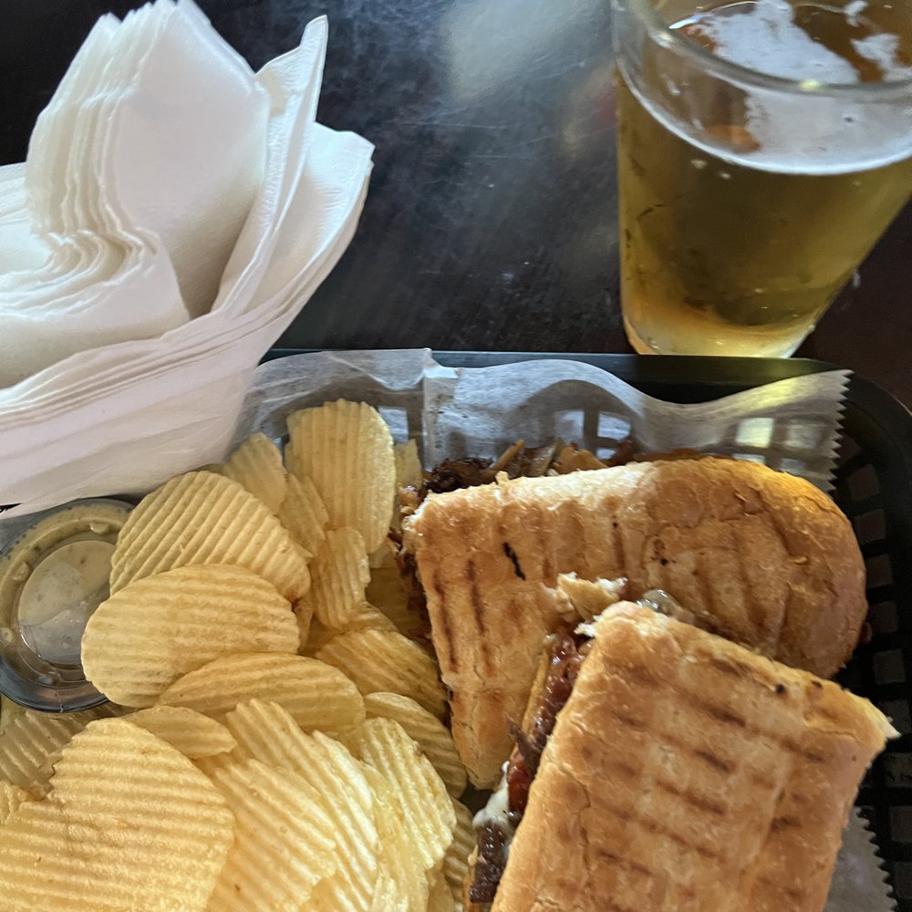 Garage Philly cheesesteak and chips. Garage Philly cheesesteak and chips.