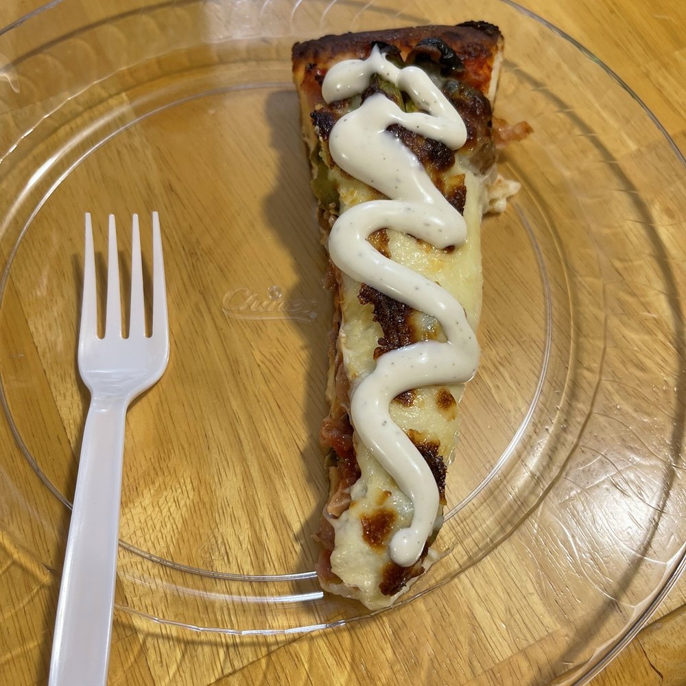 Fedora's Pizza & Deli - a slice of pizza on a clear plate - Pizza Near Me - Peoria, Illinois Fedora's Pizza & Deli - a slice of pizza on a clear plate - Pizza Near Me - Peoria, Illinois