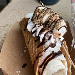 Rollin - Fluffy fingers Ice Cream Taco- Hand Rolled ice cream, Toasted Marshmallow Butterfingers, chocolate sauce.