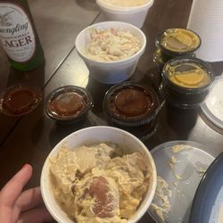 piper belle's bbq - Potato salad and slaw in the back. A bunch of sauces