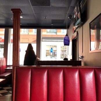 Royal Restaurant - a woman sitting in a booth - Breakfast & Brunch Near Me - Alexandria, Virginia Royal Restaurant - a woman sitting in a booth - Breakfast & Brunch Near Me - Alexandria, Virginia