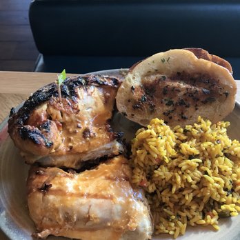 Nando's Peri-Peri - Half chicken with garlic bread and Portuguese rice - South African Near Me - Reston, Virginia Nando's Peri-Peri - Half chicken with garlic bread and Portuguese rice - South African Near Me - Reston, Virginia