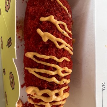 Mochinut - Whole Mozzarella hot dog with hot Cheetos topping and spicy mayo drizzle - Donuts Near Me - Plano, Texas