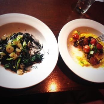 Tutto Bene - Left: Squid ink risotto w/ shrimp & sausage.Right: Saffron risotto w/ oxtail ragu, smoked cherry tomatoes (!!), scallops. A++++ - Italian Near Me - Bemidji, Minnesota