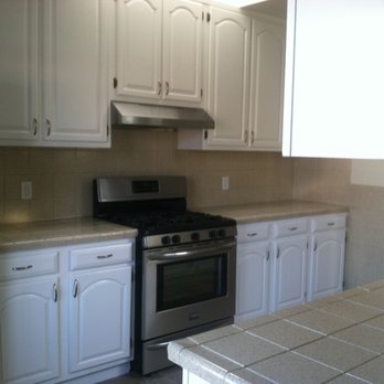 Superb Builders & Custom Made Cabinetry - Before - Horrible painted tile countertops, leaking windows - General Contractors Near Me - San Francisco, California Superb Builders & Custom Made Cabinetry - Before - Horrible painted tile countertops, leaking windows - General Contractors Near Me - San Francisco, California