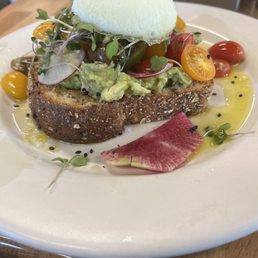 Avocado toast with an over poached egg