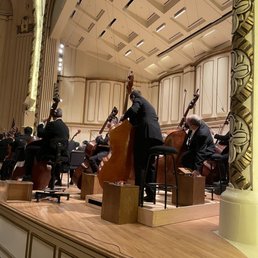 the orchestra playing in a concert
