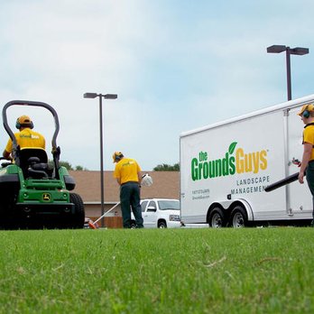 The Grounds Guys of Suwanee - a man mowing the grass - Landscape Architects or Designers Near Me The Grounds Guys of Suwanee - a man mowing the grass - Landscape Architects or Designers Near Me