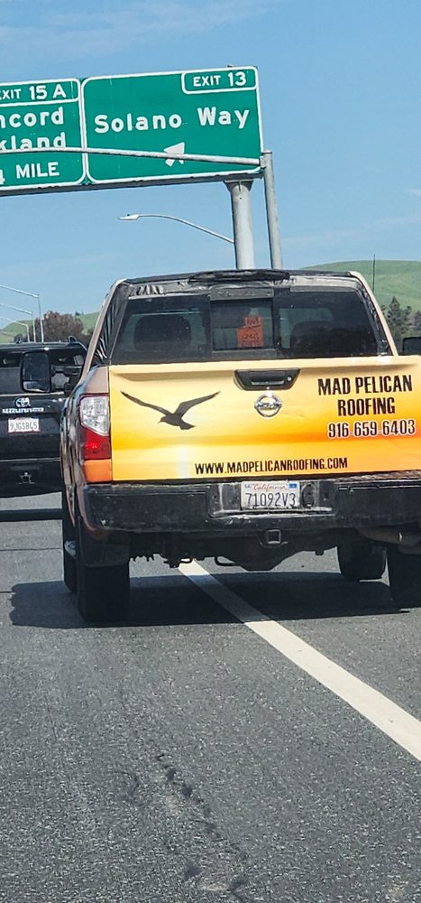 Slide of Mad Pelican Roofing