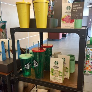 Starbucks - a shelf of starbucks cups and coffee mugs - Coffee & Tea Near Me - Edmonton, Alberta Starbucks - a shelf of starbucks cups and coffee mugs - Coffee & Tea Near Me - Edmonton, Alberta