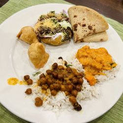Delta Mart - Samosa, Aloo Tikki, Roti, Butter Chicken, and Kala Chana  (clockwise from 10:00)