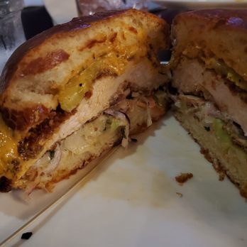 Square Roots - Smashville Chicken Sandwich -Inside view- pickles, slaw, remoulade sauce , & hot chicken on buttered brioche..so good - Gastropubs Near Me - Crown Point, Indiana