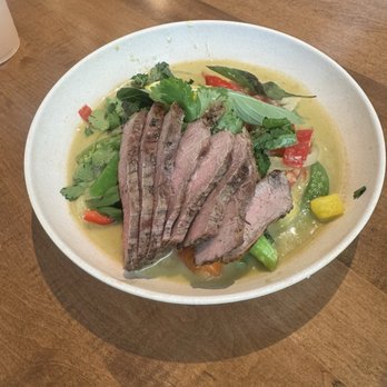 Flower Child - Spicy Coconut Green Curry with steak - Salad Near Me - Plano, Texas