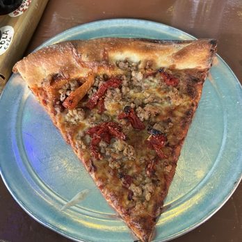 Satchel's Pizza - Sausage and sun dried tomato pizza - Pizza Near Me - Gainesville, Florida Satchel's Pizza - Sausage and sun dried tomato pizza - Pizza Near Me - Gainesville, Florida