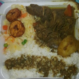 Curry Goat with white rice and steamed veggies. Curry Goat with white rice and steamed veggies.