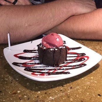 Corndance Tavern - Chocolate molten cake with a homemade wildberry sorbet! - Bars Near Me - Mishawaka, Indiana Corndance Tavern - Chocolate molten cake with a homemade wildberry sorbet! - Bars Near Me - Mishawaka, Indiana