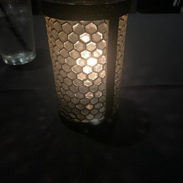 a lit candle on a table