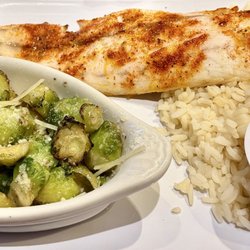 Rusty's Raw Bar & Grill - Blackened redfish platter with rice, creole sauce, roasted parm garlic brussles and a bit of pineapple slaw