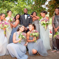 Kim Rix Photography - Charlies Angels style photo fun with the Groom and Bridesmaids. 
Image by Kim Rix Photography.