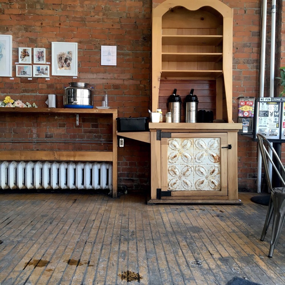 a kitchen with a brick wall