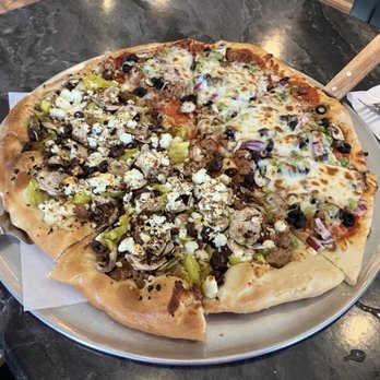 Mt Pizza And Brews - Large pizza. Good toppings. Dough seems undercooked and needs more sauce - Pizza Near Me - Sandy, Oregon