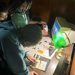 In Search Of An Exit Escape Rooms - Solving the case, putting in the work.