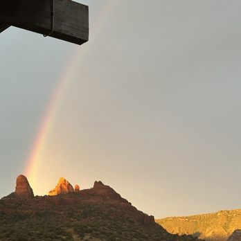 Open Range Grill and Tavern - Sunset rainbow on the ridge behind the restaurant. - American Near Me - Sedona, Arizona Open Range Grill and Tavern - Sunset rainbow on the ridge behind the restaurant. - American Near Me - Sedona, Arizona