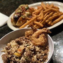 Dusse Sports Bar and Lounge - Dusse Dog, fries, dirty rice and shrimp!!