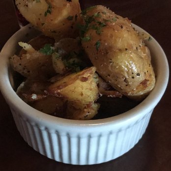 Feast At 316 - Smash Fried Potato's. Was like a crisp truffle French fry. Looks small in pic but it's a good amount 1 person on top of dinner. - Steakhouses Near Me - Camas, Washington