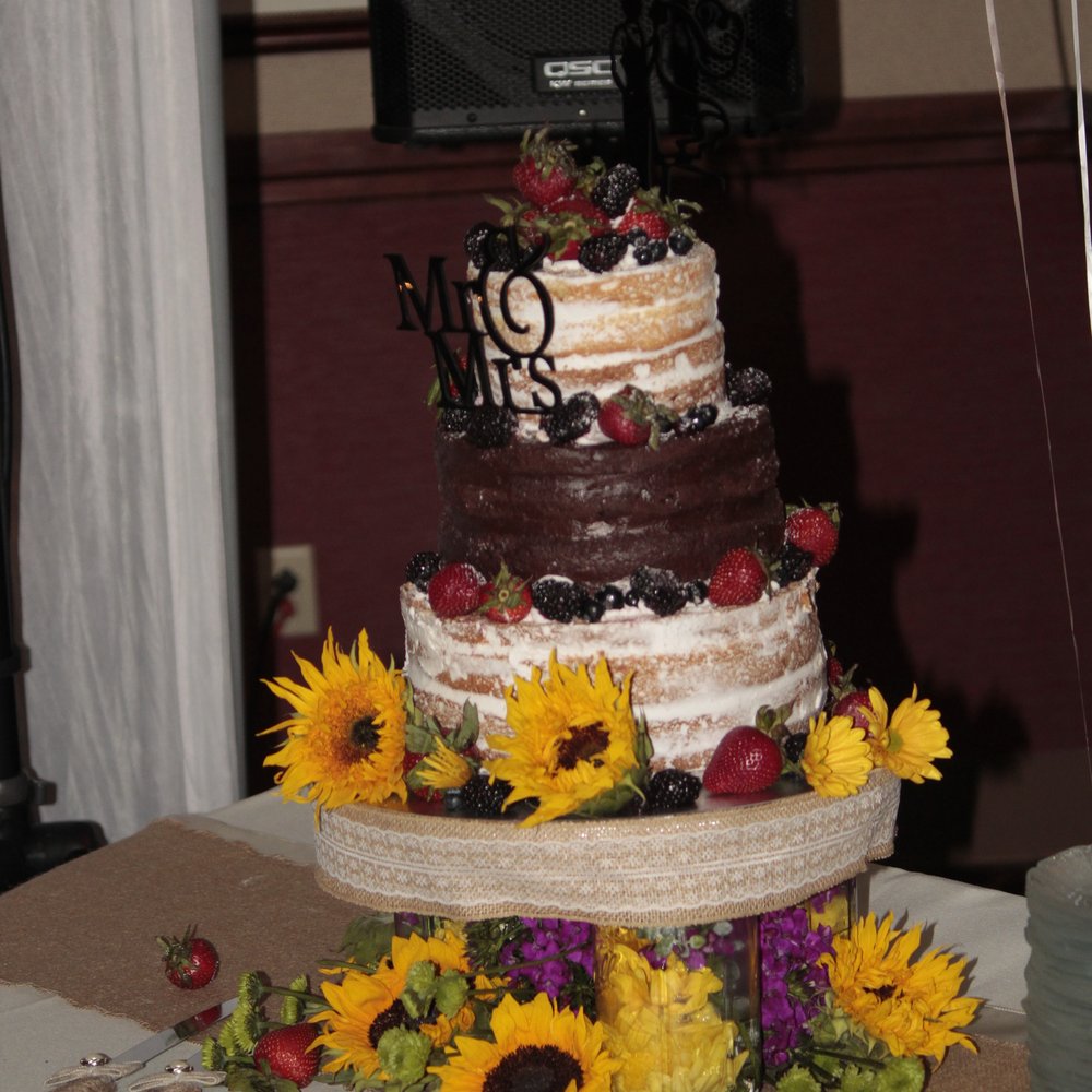 E & L Southwest Cakes - Vanilla on top/bottom, with chocolate in the middle. the layers have strawberry filling with fresh strawberries inside. Fresh berries too! - Bakeries Near Me - Tucson, Arizona