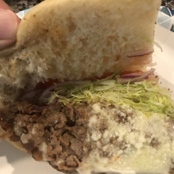 Jerry & Sal's Pizza - a hand holding a half eaten sandwich - Pizza Near Me - Hanover, Pennsylvania Jerry & Sal's Pizza - a hand holding a half eaten sandwich - Pizza Near Me - Hanover, Pennsylvania