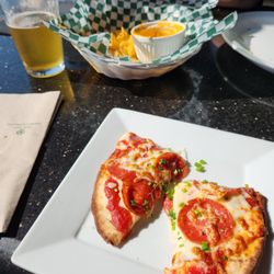 Lido Waterfront Bar & Bistro - Pita flatbread, nacho cheese, and lager