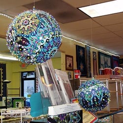 Cool ornament made with fabric, sequins and beads.