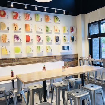 Freshii - a table and chairs in a restaurant - Salad Near Me - Maple Ridge, British Columbia Freshii - a table and chairs in a restaurant - Salad Near Me - Maple Ridge, British Columbia