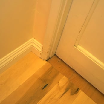 Pro Restoration - More details of ending of uneven floor. They ought to have cut moulding with wood floor cut exact to wall and floor under door as well. - Damage Restoration Near Me - Northridge, California Pro Restoration - More details of ending of uneven floor. They ought to have cut moulding with wood floor cut exact to wall and floor under door as well. - Damage Restoration Near Me - Northridge, California