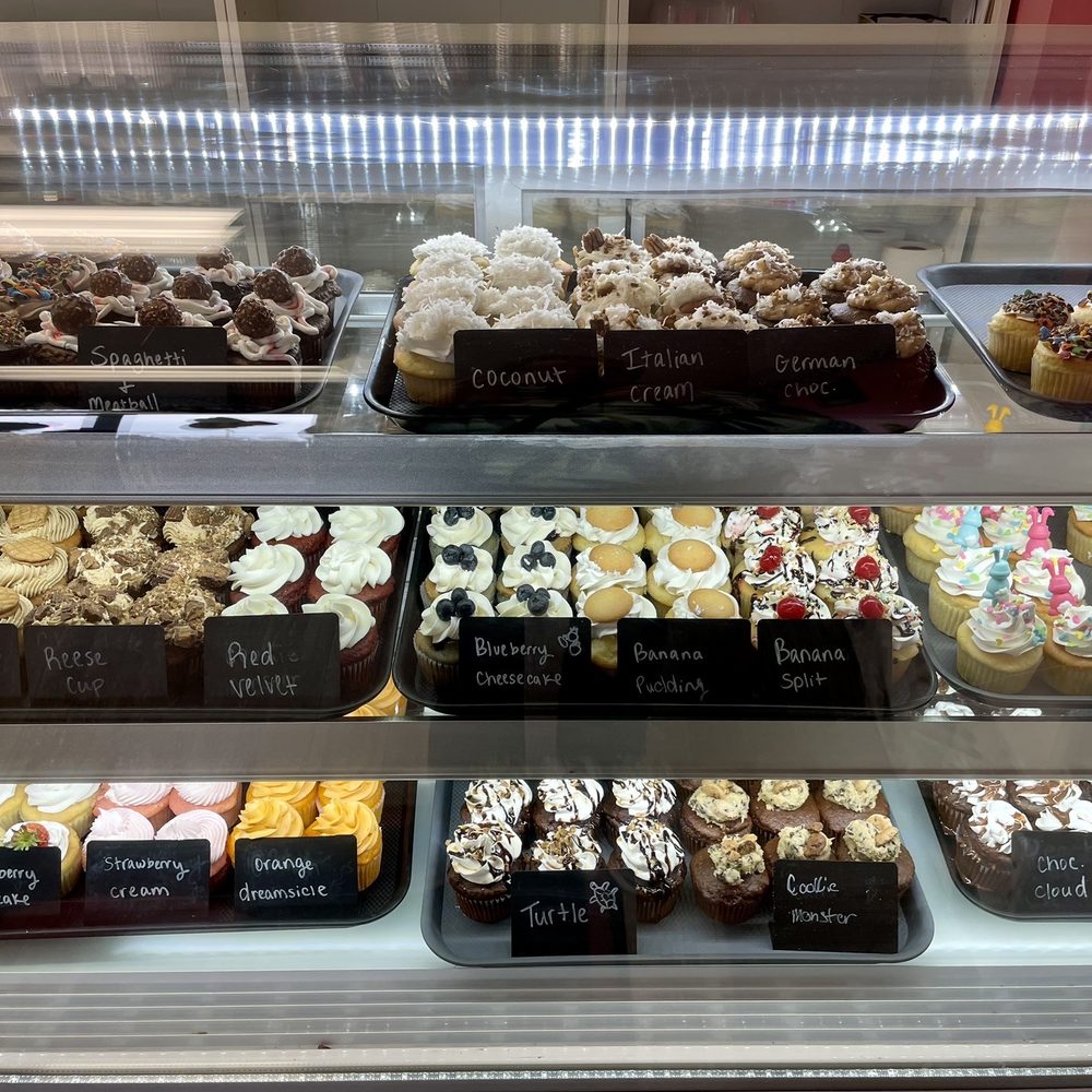 Double Drizzle - a variety of cupcakes in a display case - Bakeries Near Me - Ashland, Kentucky Double Drizzle - a variety of cupcakes in a display case - Bakeries Near Me - Ashland, Kentucky