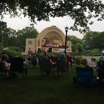 Reading Bandshell Series - people sitting in lawn chairs under a tree - Music Venues Near Me - Reading, Pennsylvania