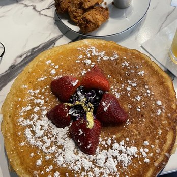 Breakfast At Barneys - 24karat gold pancakes & chicken burnt bacon in the background - Breakfast & Brunch Near Me - Atlanta, Georgia Breakfast At Barneys - 24karat gold pancakes & chicken burnt bacon in the background - Breakfast & Brunch Near Me - Atlanta, Georgia