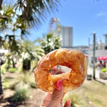 Britt's Donuts - a hand holding a donut - Donuts Near Me - Carolina Beach, North Carolina Britt's Donuts - a hand holding a donut - Donuts Near Me - Carolina Beach, North Carolina