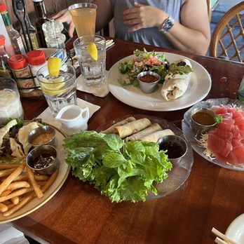 Buzz's - Left to Right: Jack Daniel's Burger, Beef Spring Rolls, Fresh Fish Burrito - Steakhouses Near Me - Kailua, Hawaii Buzz's - Left to Right: Jack Daniel's Burger, Beef Spring Rolls, Fresh Fish Burrito - Steakhouses Near Me - Kailua, Hawaii