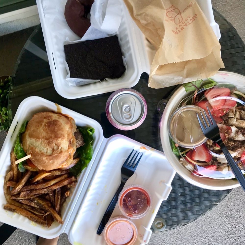 Nectarine Grove - Grove Salad, Classic Burger, Brownie, Chocolate Chip Cookie, Donut half eaten hiding in the bag. - New American Near Me - Encinitas, California Nectarine Grove - Grove Salad, Classic Burger, Brownie, Chocolate Chip Cookie, Donut half eaten hiding in the bag. - New American Near Me - Encinitas, California