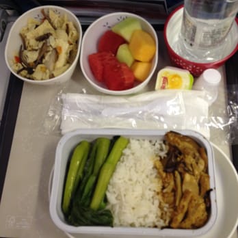 Cathay Pacific - HKG to LAX.  Economy class, Oriental vegetarian special meal.  A lot of tofu and mushrooms.  I wish more green veggies. - Airlines Near Me - Los Angeles, California