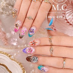 Hand-painted floral nails that bloom with every detail.  Book your appointment today!