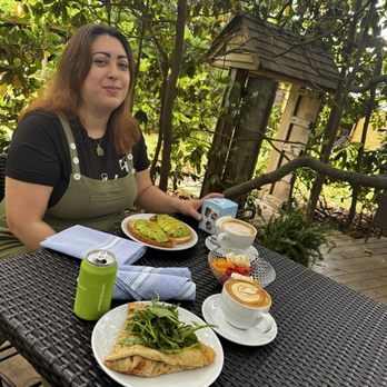 Cafe Davina - My friend has a large late with avocado toast and that's my crape. We're eating inside the magnolia tree that's as old as the house. - Creperies Near Me - Suffolk, Virginia Cafe Davina - My friend has a large late with avocado toast and that's my crape. We're eating inside the magnolia tree that's as old as the house. - Creperies Near Me - Suffolk, Virginia